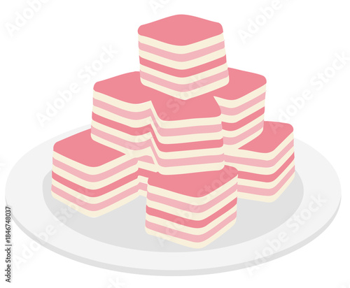 stack of malaysian layered cake or kue lapis on a white plate