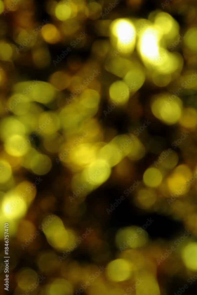 Fototapeta premium Abstract Bokeh Background of Shimmering Gold and Yellow Lights