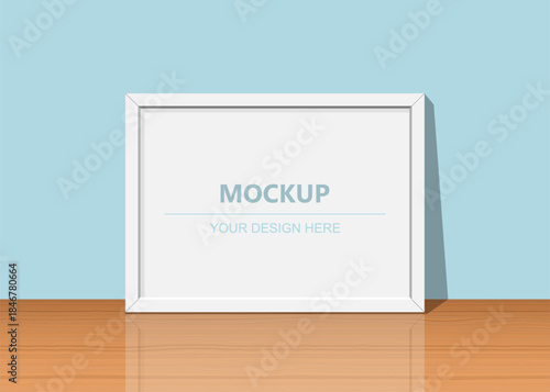 Blank frame mockup on wooden surface