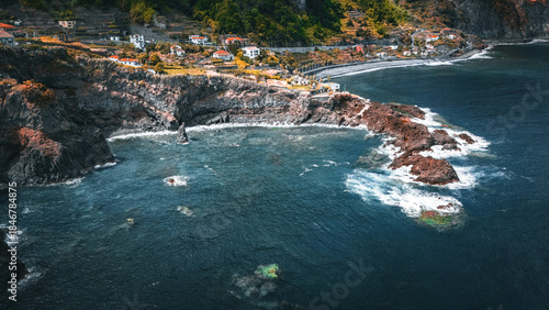 Aerial top‑down view of the rugged volcanic coastline and natural lava rock pools at Seixal on the island of Madeira, Portugal