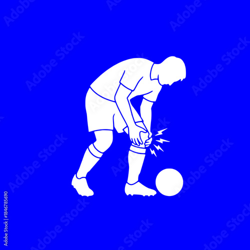 Football player clutching knee in pain during match