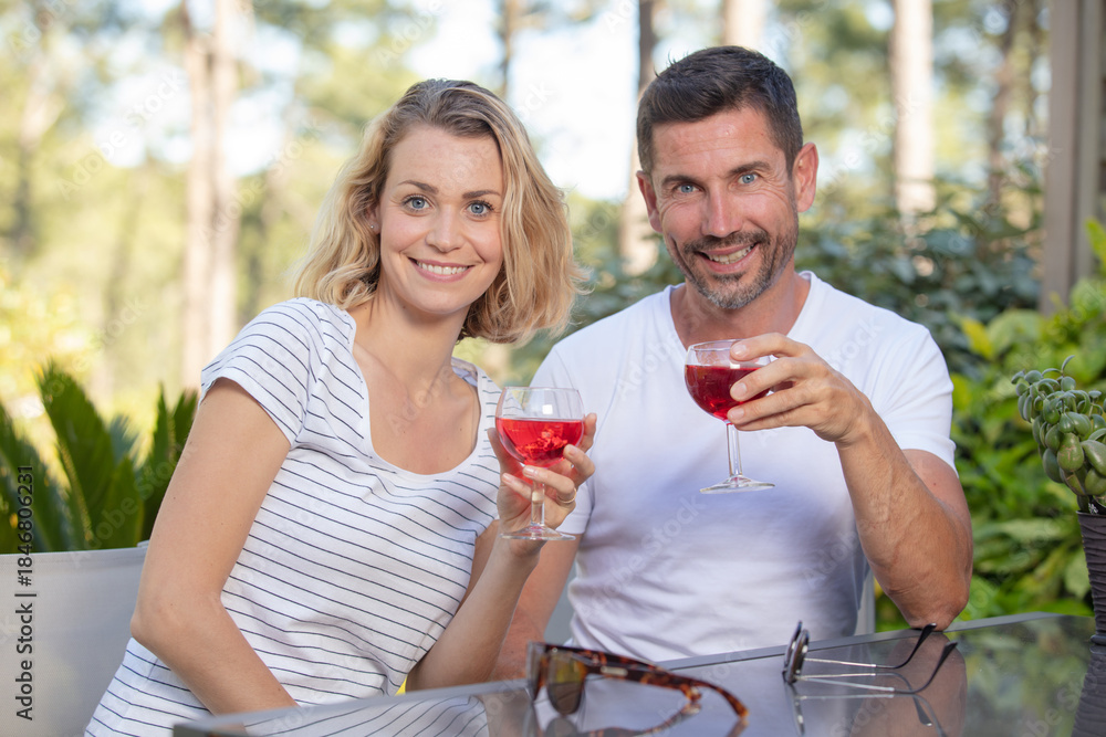 Fototapeta premium couple enjoying a glass of wine in a bar