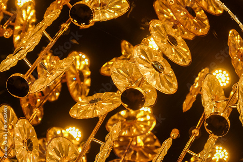 Elegant golden crystal chandelier with warm glowing light