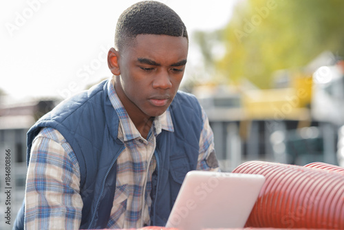 engineer wit tablet outdoors