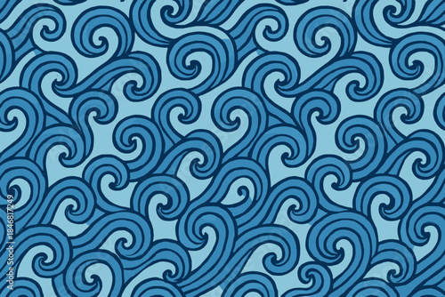 Waves create patterns on a blue background with swirling designs during daylight hours