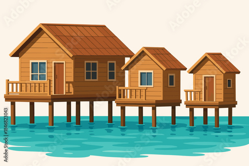Wooden houses on stilts above clear water near a shoreline in a coastal area during the daytime