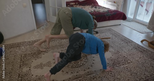Man Does Exercise Workout with Kid at Home. 4K 10-bit