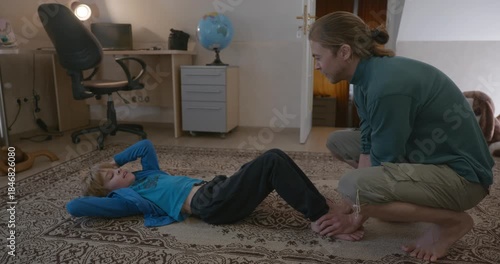 Man Does Exercise Workout with Kid at Home. 4K 10-bit