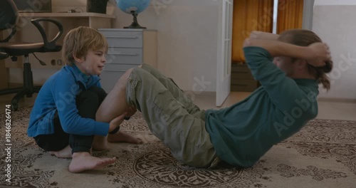 Man Does Exercise Workout with Kid at Home. 4K 10-bit