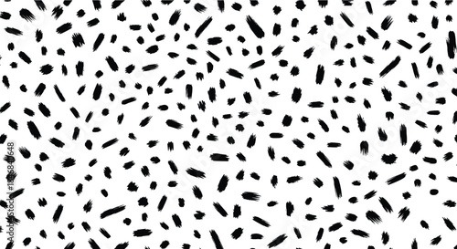 Abstract seamless pattern with chaotic black brush strokes and dots on a white background for a modern design.
