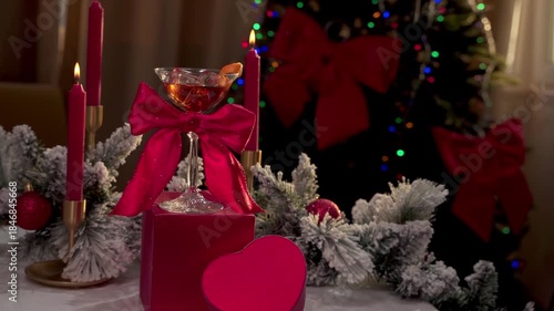 Festive Holiday Cocktail with Red Bow on Gift Boxes. Pull out shot