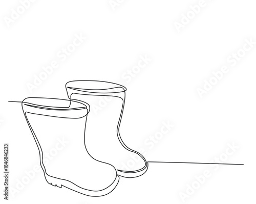 One continuous line drawing of farmer boots. Rubber boots outline drawing illustration.