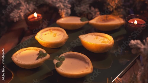 Lemon Posset on Platter with Candles and Festive Lights. Tracking shot