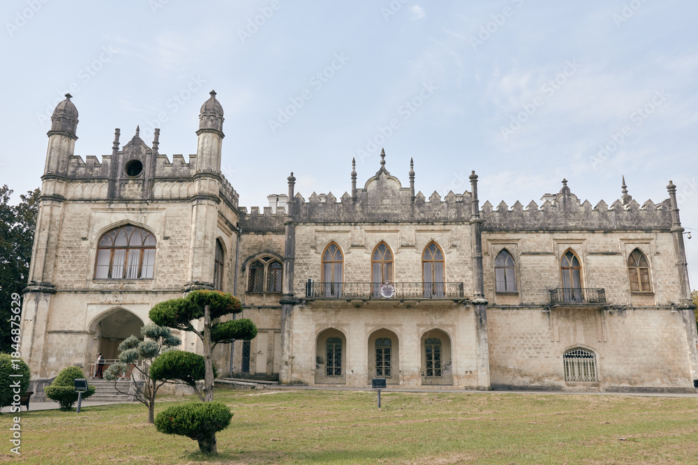 Obraz premium Mansion manor historic architecture facade estate castle building on lawn and garden