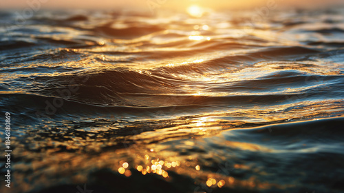 Golden sunlight reflecting on the rippling ocean waves