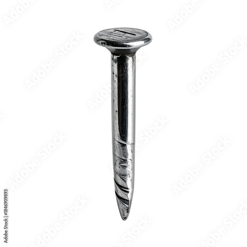 A single silver metal nail with a slotted head photographed against a black background.