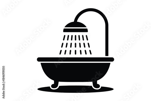 Black and white of a shower head over a bathtub with water droplets