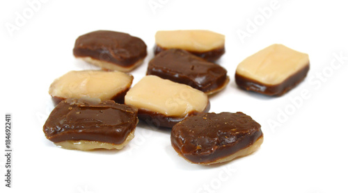 Caramel candies isolated on white background