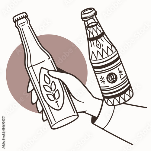 Hand holding two patterned beer bottles leaf