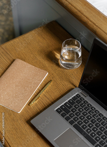 Cozy home office aesthetic with warm brown table and laptop