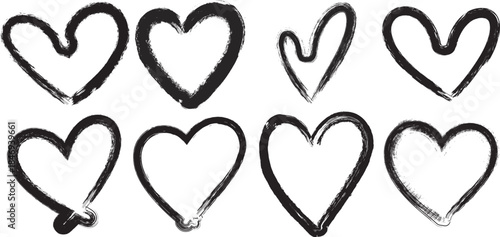 Creative black hearts with artistic brush strokes on transparent background