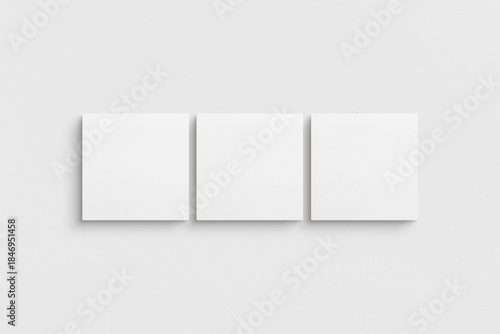 Canvas mockup 1:1 square. Set of three square canvases. Clean, modern, minimalist, bright gallery wall mockup, set of 3 canvases on a white wall.