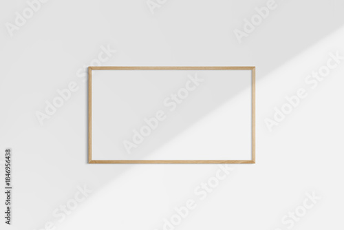 Horizontal frame mockup 16:9, 9:16 landscape. Single oak wood frame mockup. Clean, modern, minimalist, bright. Shadow overlay.