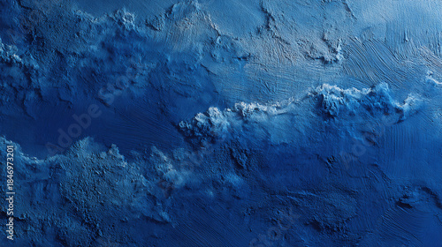 An aerial view of the ocean, capturing the mesmerizing depths and dynamic textures of the water