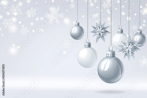 Silver Christmas ornaments hanging against a soft white background, with copy space for design