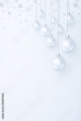 Silver Christmas ornaments hanging against a soft white background, with copy space for design