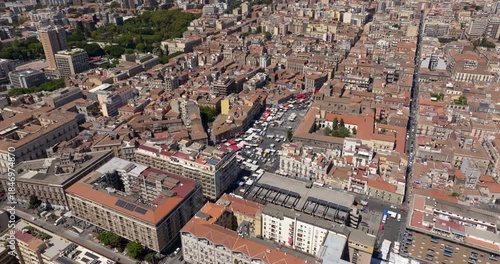 Aerial view of the local market in Piazza Carlo Alberto, located in the historic center of Catania, Sicily, Italy. It is the oldest and most historic market of the town. It is a sunny day morning.