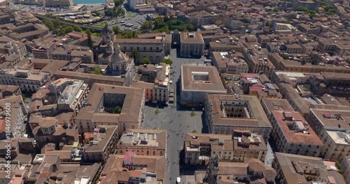 Aerial view of Piazza Università in the historic center of Catania, Sicily, Italy. It is one of the city's main squares. Nearby is the Church of Sant'Agata, the town's cathedral. Sunny day morning.