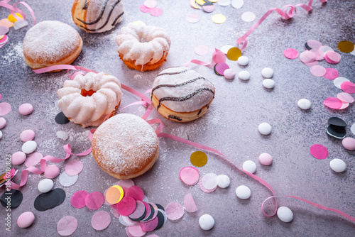 Colorful donuts, berliner and pastries for party and carnival
