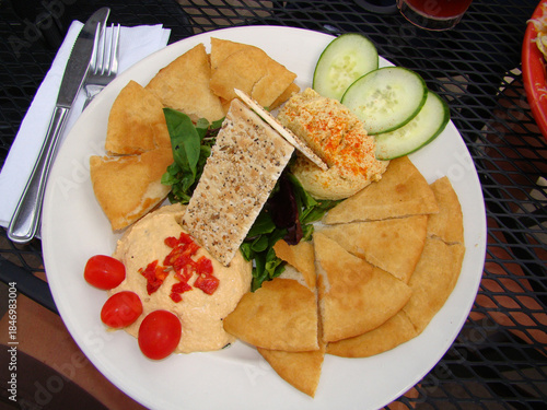 Hummus food plate pita bread cucumbers
