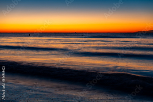 Fishing Boat on Horizon at Twilight