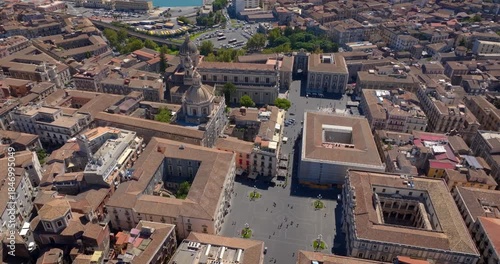 Aerial view of Piazza Università in the historic center of Catania, Sicily, Italy. It is one of the city's main squares. Nearby is the Church of Sant'Agata, the town's cathedral. Sunny day morning.