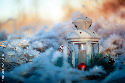 Holiday background with spruce wreath and Christmas candlestick standing in N...