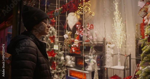 Young woman looking at some Christmas special offers at the local store