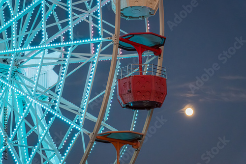 Ferris wheel at Tibidabo under a moonlit sky