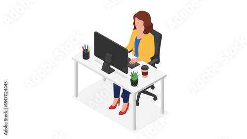 Female employee focused on work at modern office desk with computer
