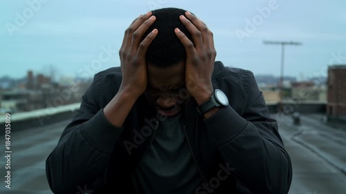 A person experiences frustration and holds head in anguish Stock Video