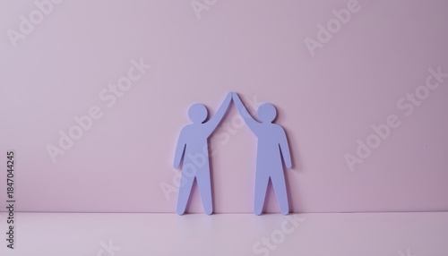 Two abstract figures giving a high five against a pastel pink background representing friendship and teamwork in a conceptual manner