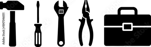 A set of black silhouettes featuring a hammer, screwdriver, wrench, pliers, and toolbox