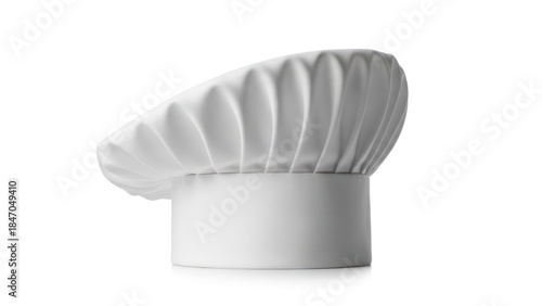 White chef's hat, slightly wrinkled, casting a shadow