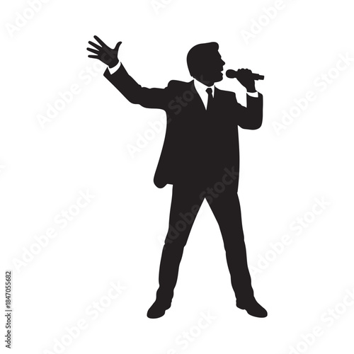 Silhouette of a man singing into a microphone with a raised hand