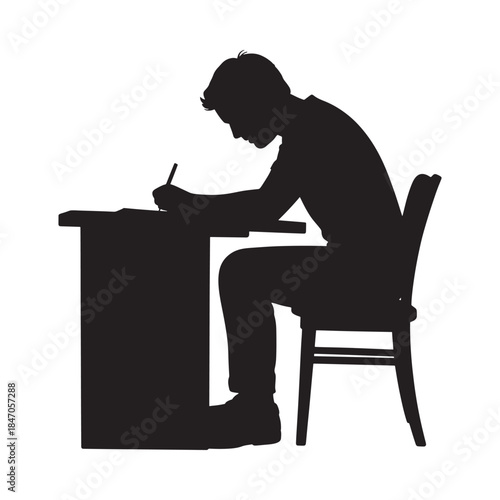 Silhouette of a person studying at a desk with focused concentration