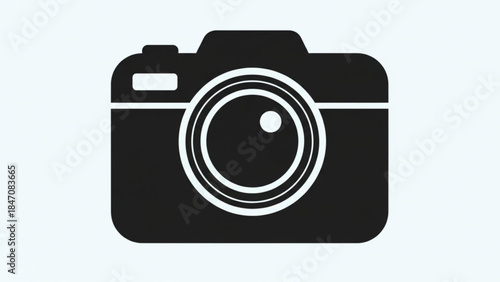 Camera Silhouette: A sleek, monochrome illustration of a classic camera, embodies the essence of photography and image capture. 
