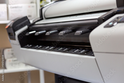 A large plotter on a drawing, suitable for technical and engineering projects.