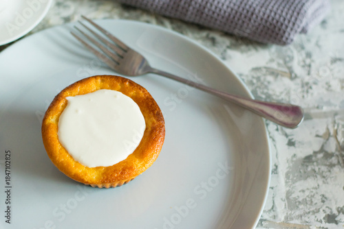 Delicious cheesecake with sour cream on a plate. Breakfast concept for the family