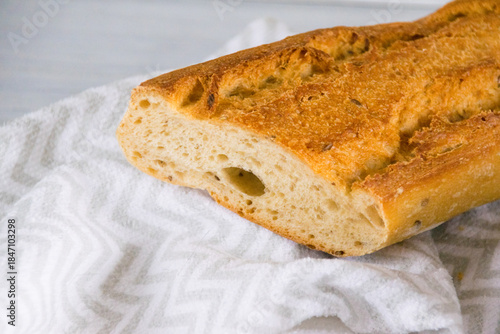 Fragrant baguette with sesame and buckwheat flour. Healthy bread for breakfast